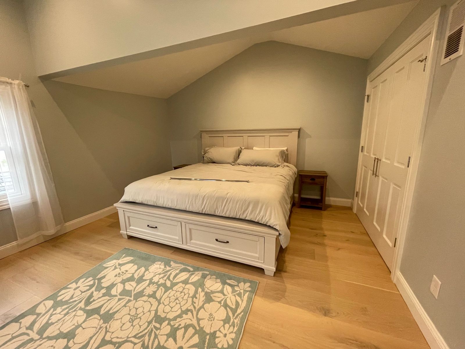 Bedroom with sloped ceiling