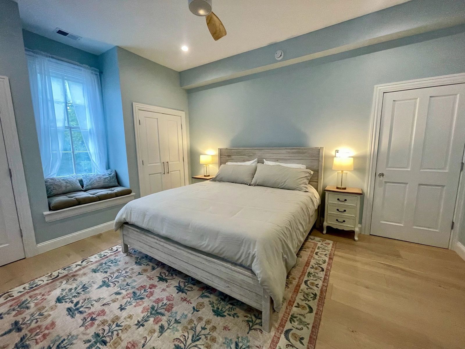 Bedroom with queen bed and window seat