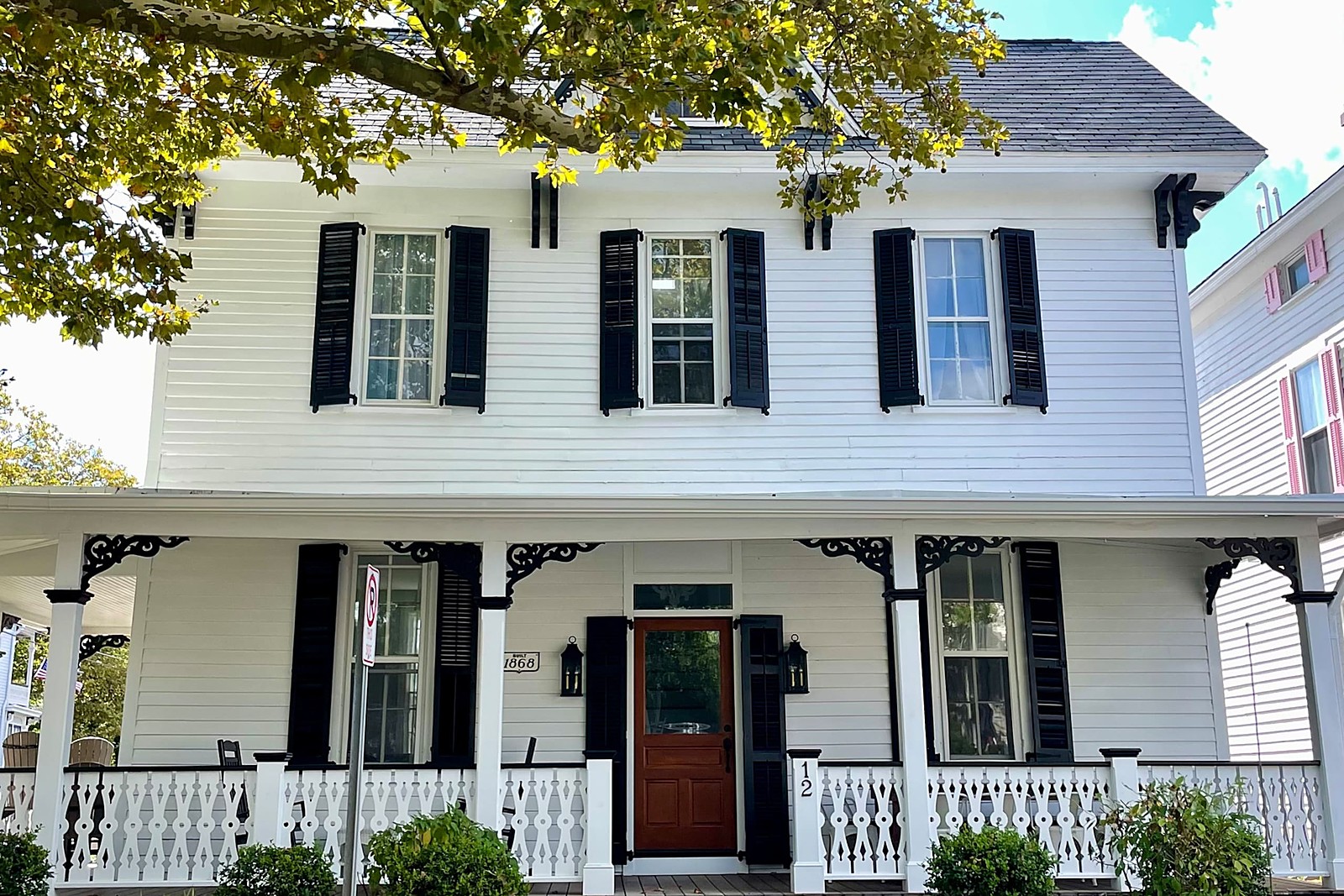 The Ware House Cape May — the front of the 1868 Victorian with its red door and porch