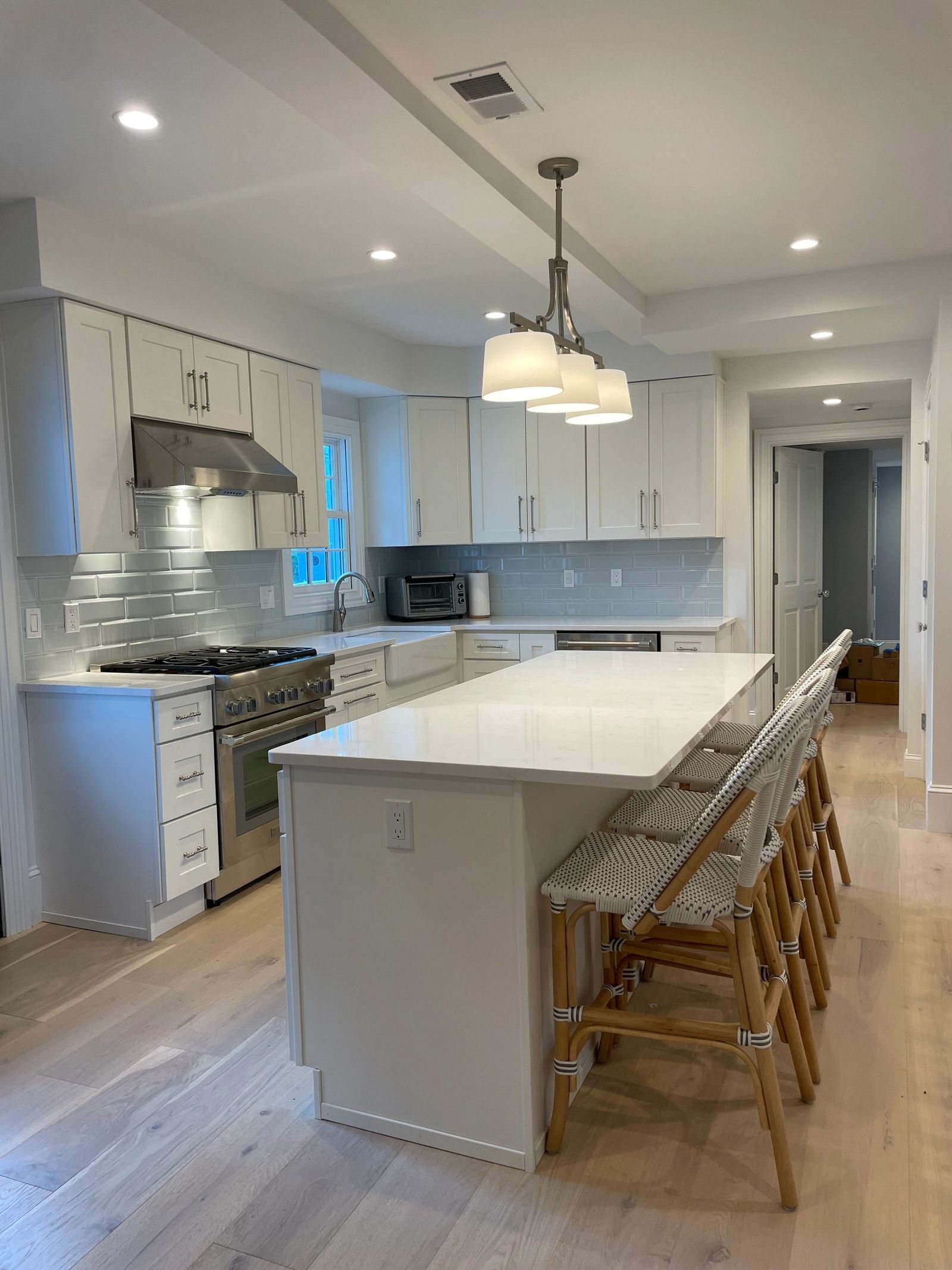 Kitchen with white cabinets and island