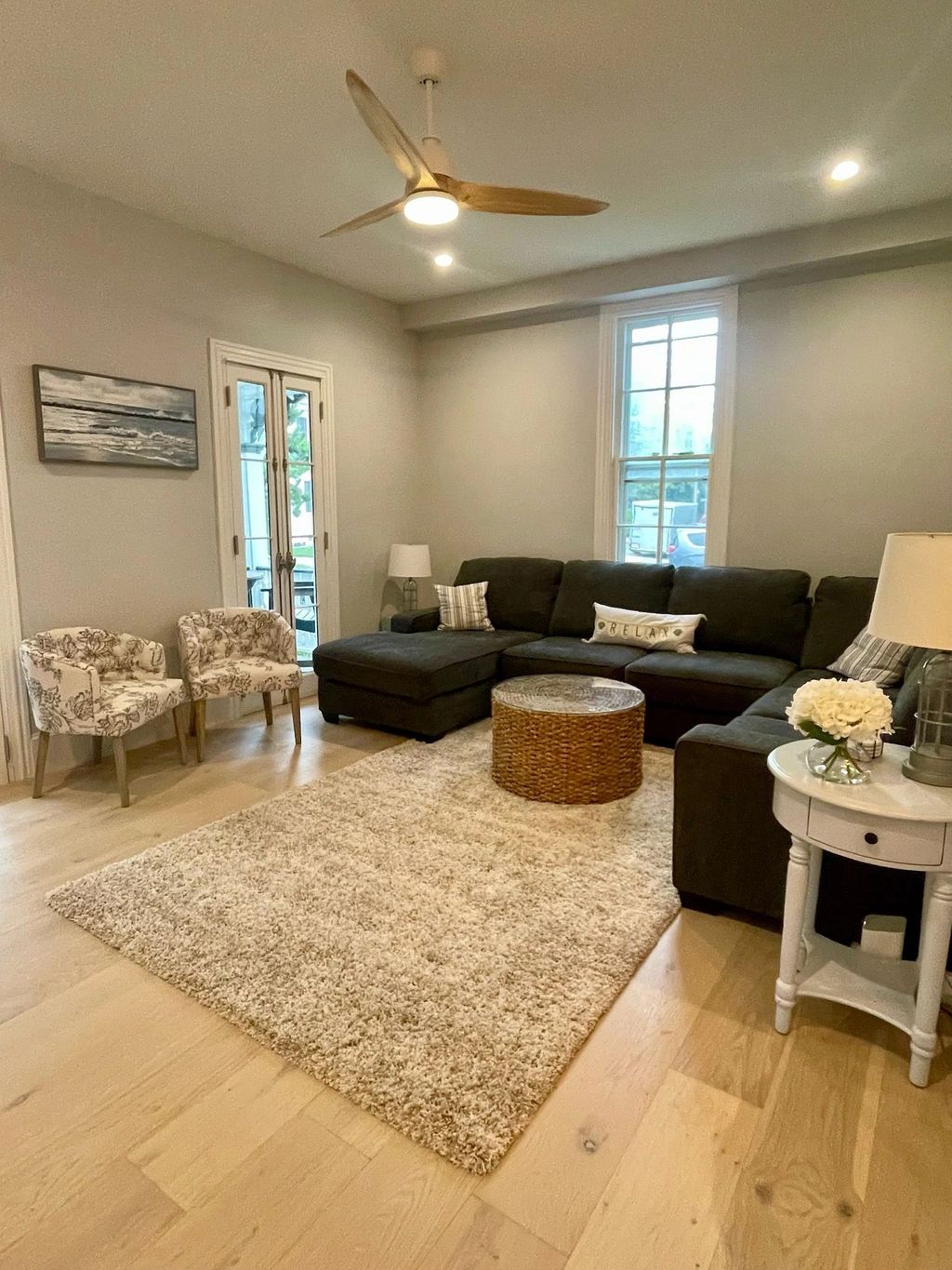 Living room with sectional sofa and ceiling fan